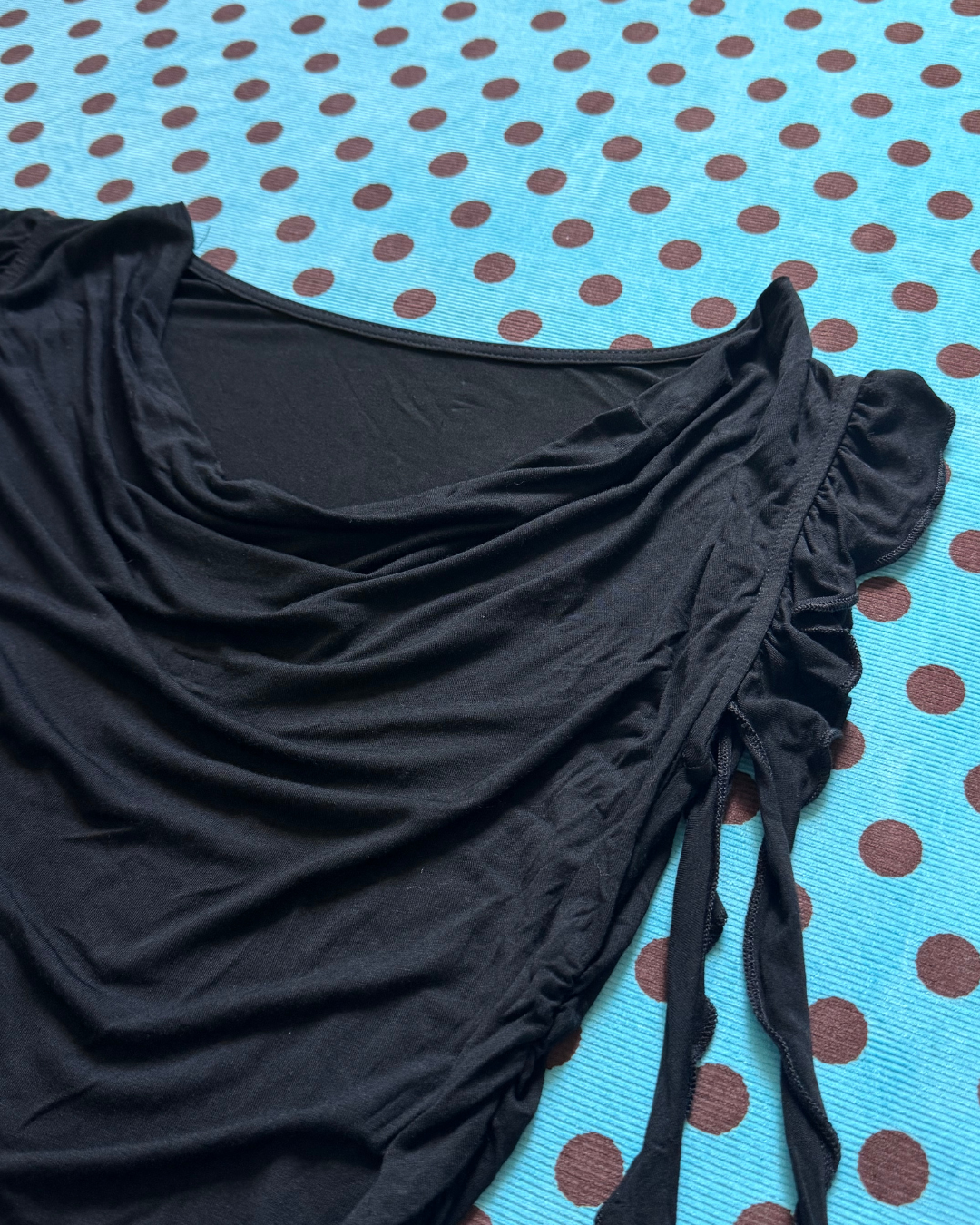 black ruffled top